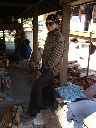 Robin Hominiuk stoking an anagama wood-fired kiln