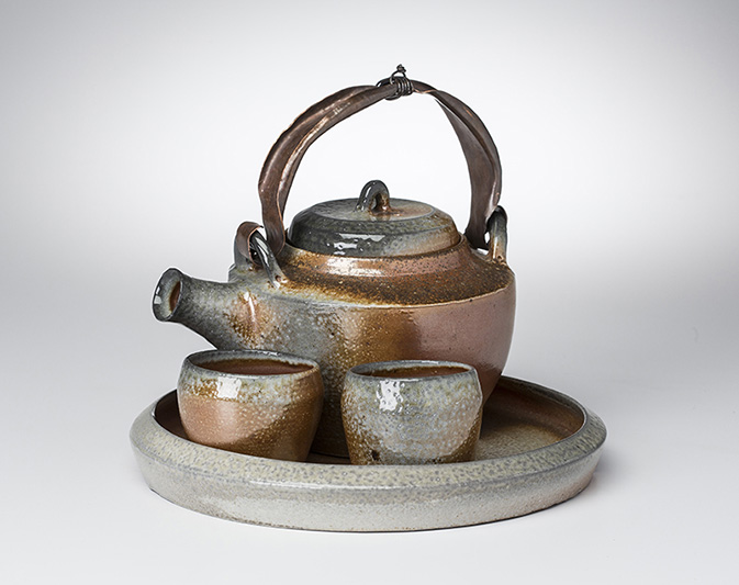 Copper-handled teapot